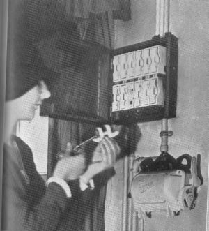 Female Engineer from the 1930s with a fusebox