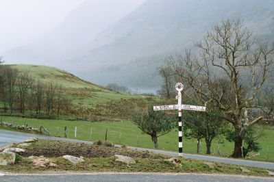 Sign and a view over a lake in the lakes